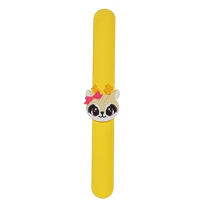 Cute cartoon deer slap bracelet detail, yellow silicone wristband with adorable animal charm for kids.