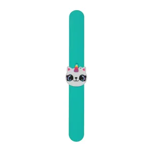 Close-up detail of the cute cartoon cat unicorn charm on green silicone slap bracelet wristband.