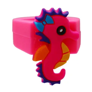 Detailed close-up view of the cute pink cartoon seahorse ring, made of soft PVC rubber for kids.