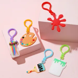 Kunst thema PVC sleutelhangers met penselen en kleurenpalet, schattige accessoires.