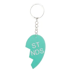 Cute PVC soft rubber split heart keychain for best friends, durable metal ring and chain accessory.