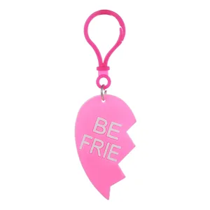 Pink PVC soft rubber half-heart keychain pendant detail shot with white letter print.