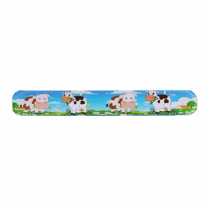 Close-up detail of the cute cartoon farm cow print PVC slap bracelet, vibrant colorful design.