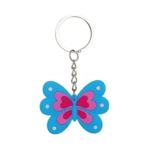 Porte-clés en silicone papillon bleu avec motif de cœur mignon et anneau métallique.