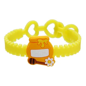 Détail du bracelet PVC mignon pot de miel dessin animé, bijoux réglables pour enfants.