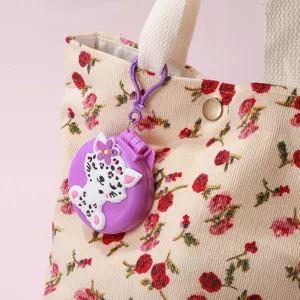 Portable folding hair brush mirror compact, cute cartoon cat design detail view.