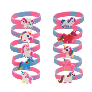 Colorful silicone unicorn wristbands with cute PVC cartoon charms, perfect for kids party gifts.