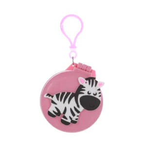 Closeup view of cute cartoon zebra patterned pink mini portable folding cushion comb detail.