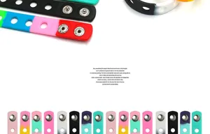 Close-up details of colorful silicone wristbands with metal snap buttons for DIY accessories.