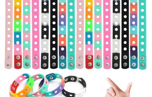 Detailed view of colorful silicone wristbands with metal snap buttons for versatile wear.