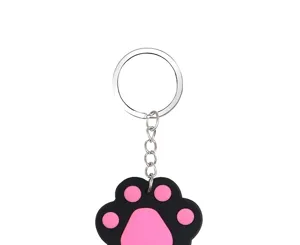 Cute silicone cat paw keychain with metal ring and chain, perfect pet lover accessory.
