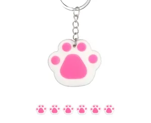 Cute cat dog paw keychain close up detail view, pink white silicone pendant ring