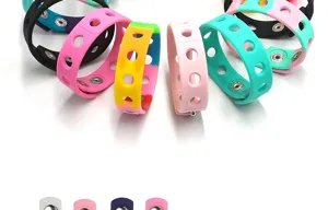 Colorful silicone wristband bracelet with metal snap buttons, stylish multi-color design.
