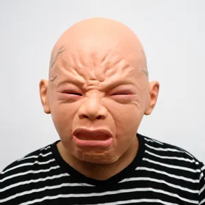Detail view of creepy crying baby latex mask, funny Halloween party costume prop.