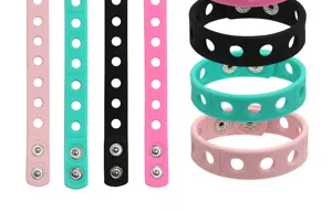 Multicolor silicone wristbands featuring metal snaps and hole designs, perfect for DIY charms.