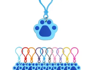 Detailed view of colorful plastic paw print keychains showing various vibrant clasp options.