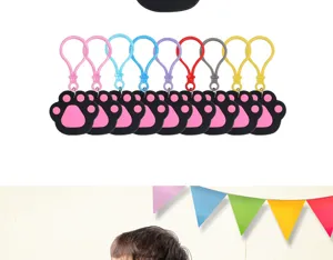 Colorful paw print keychains set for cute pet party supplies and birthday decorations.