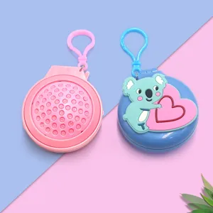 Brosse à cheveux ronde pliable portable coussin d'air miroir porte-clés design mignon.