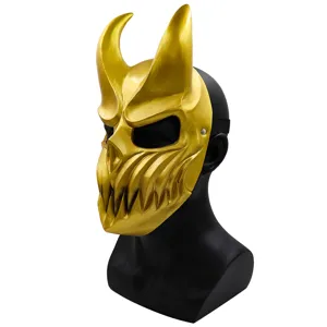 Golden devil mask detail shot, featuring sharp horns and aggressive teeth design for parties.