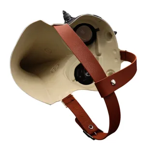 Steampunk plague doctor mask interior detail close-up showing adjustable brown leather straps.