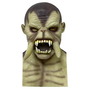 Detailed close-up of the horrific orc monster mask with long tusks for Halloween parties.