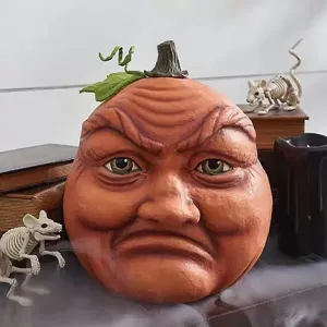 Halloween creepy pumpkin head decoration detail, spooky outdoor yard prop for party setup.