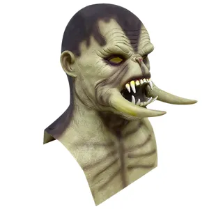 Halloween horror monster mask with long tusks, creepy latex creature headgear for party.