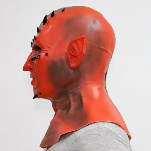 Detailed side view of the red latex devil mask with black spikes for halloween party costumes.