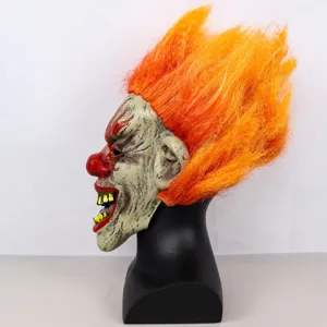 Detailed side view of scary flame clown mask with orange hair for Halloween party and cosplay events.