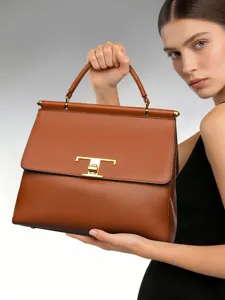 Elegant brown leather handbag for women with gold tone hardware and top handle design.