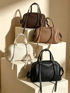 Classic soft leather boston handbag detail, multi-color display with top handles and strap.