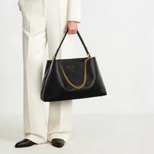 Black leather large capacity tote handbag with gold chain stylish commuter shoulder bag daily use