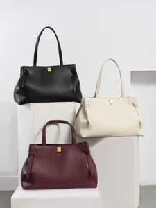 Minimalist pebbled leather shoulder bag, stylish large capacity commuting tote for women.