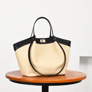 Bolso tote tejido de estilo francés elegante con ribete de cuero negro y cierre para mujer.
