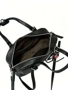 Classic black leather top handle bag with crossbody strap, spacious interior and zipper.