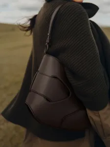 Elegant dark brown leather shoulder bag with unique stylish knotted design for daily women wear
