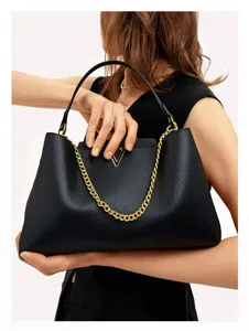 Elegant black leather tote bag with gold chain and metal V logo, stylish women commuter handbag.