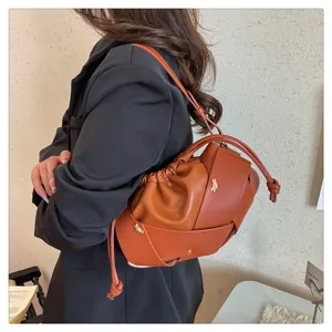 Chic brown woven shoulder bag for women, stylish crossbody cloud bag with unique knotted design.