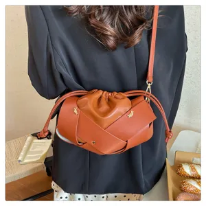 Stylish brown woven leather shoulder bag, trendy cloud crossbody purse for women daily commute.