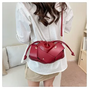Chic red woven crossbody bag for women, stylish dumpling shoulder bag with knot detail.