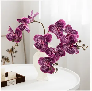 Bouquet de fleurs d'orchidées papillon artificielles en vase en céramique déco.