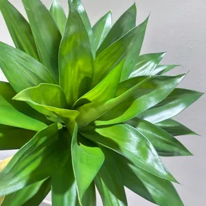 Artificial agave plant leaf detail view, realistic green foliage for home decor styling.