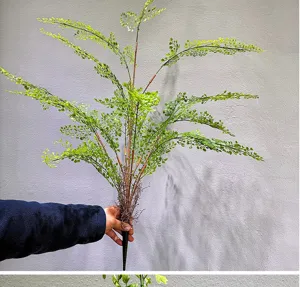 Artificial fern plant detail view, lifelike greenery stem for interior home decoration