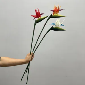 Detail view of artificial bird of paradise flower stems, vibrant colors and realistic texture.