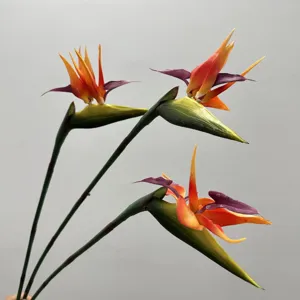 Artificial bird of paradise flower detail shot, vivid colors and realistic floral decor.