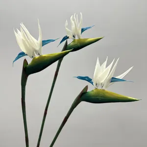 Artificial white blue bird of paradise flower detail shot, lifelike floral decor for home wedding.