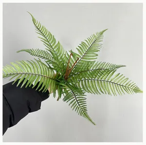Artificial Boston fern leaf fake plant green foliage detail view for home decor landscaping.