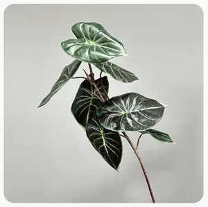 Artificial alocasia leaf detail view, high quality faux plant branch for home indoor decor.
