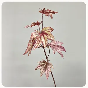 Artificial plant branch detail closeup, premium decorative foliage stem for home indoor decor.