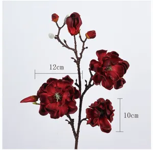 Close-up detail of dark red artificial magnolia flower branch with clear size markers.